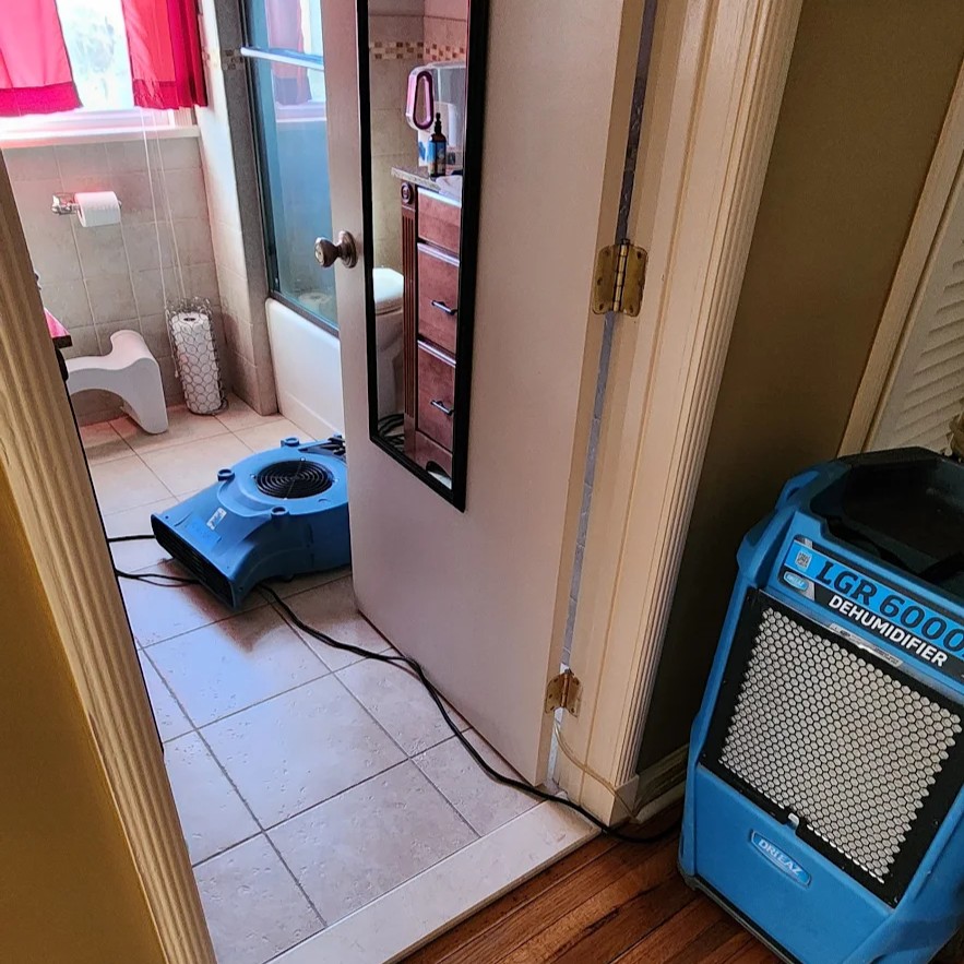 Bathroom drying after water damage Bathroom drying after water damage with professional dehumidifier and air mover by Kraus Restoration
